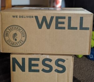 cardboard boxes that say wellness